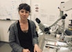 Annegret L. Falkner in front of a microscope