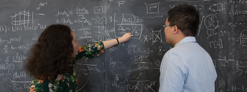 Image of Flatiron Institute scientists at the chalkboard